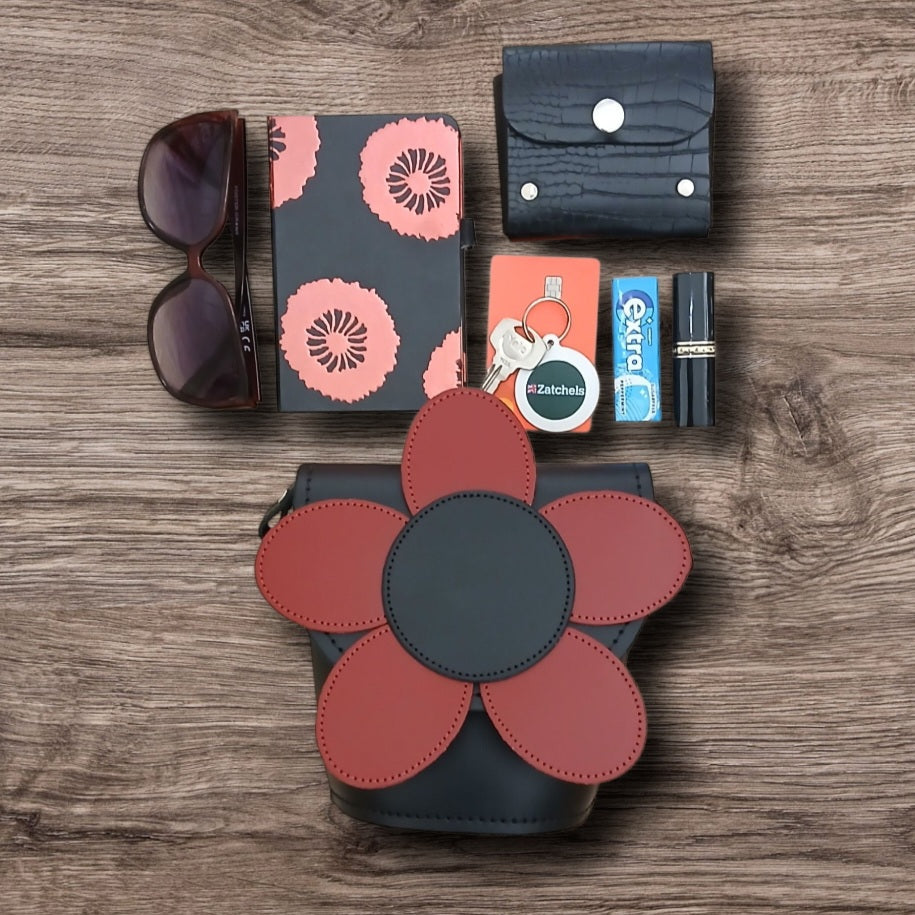 Leather daisy barrel bag with red flower appliqué and dark body