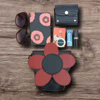 Leather daisy barrel bag with red flower appliqué and dark body