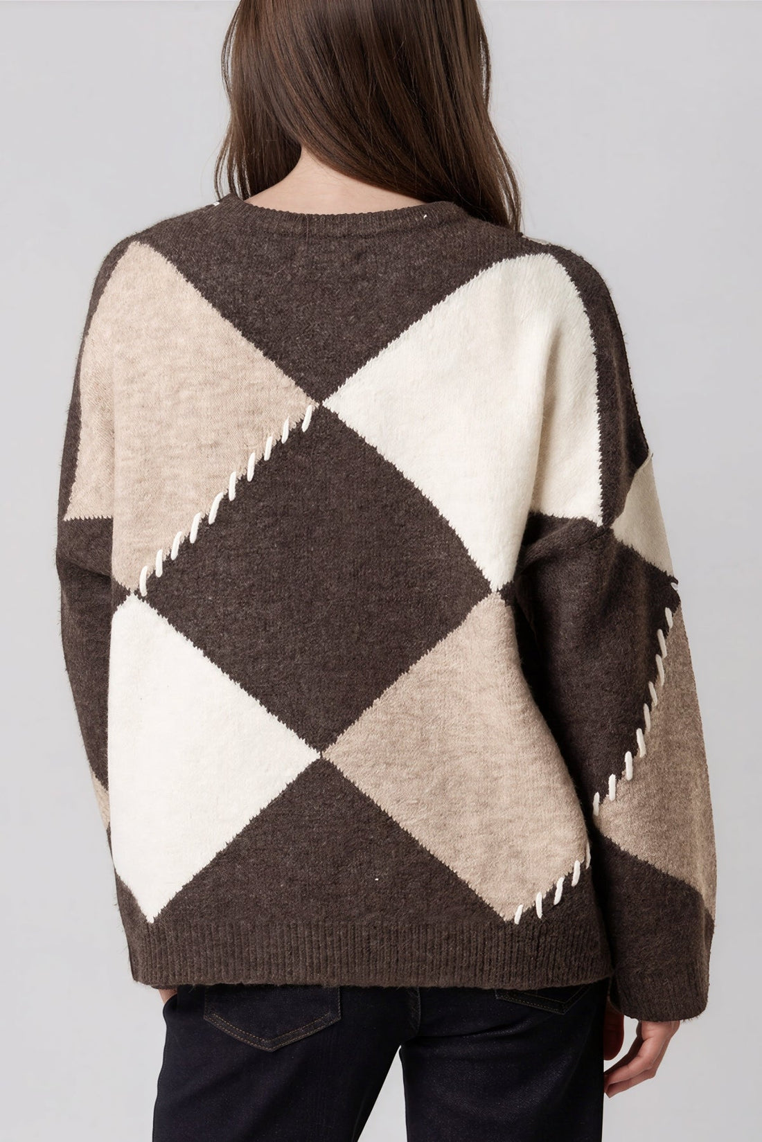 Wool-blend jumper back view in cream and dark argyle diamonds with zigzag hem detail