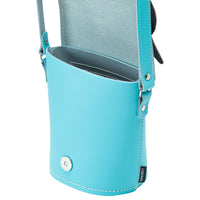 Light blue leather owl bag with snap button, side D-ring, and stitched top edge