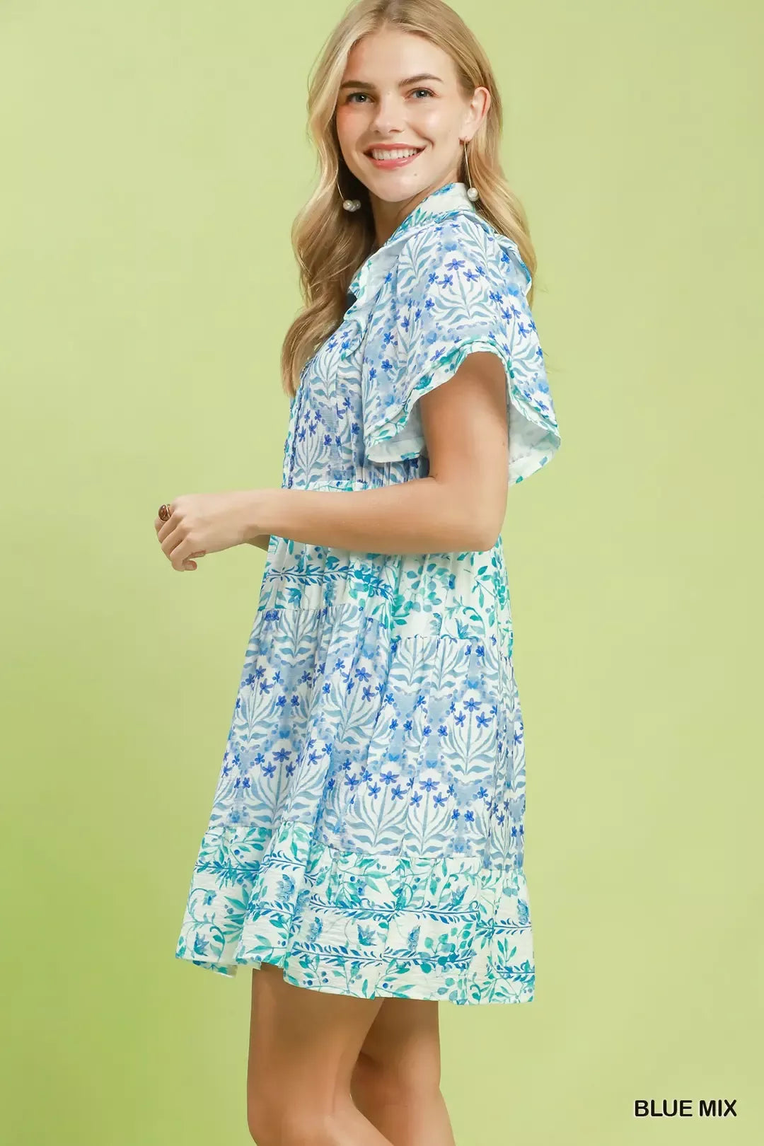 Blue floral tiered mini dress with flutter sleeves, side view