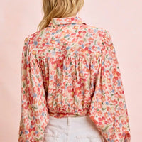 Floral print crop shirt back view with gathered yoke and tied hem