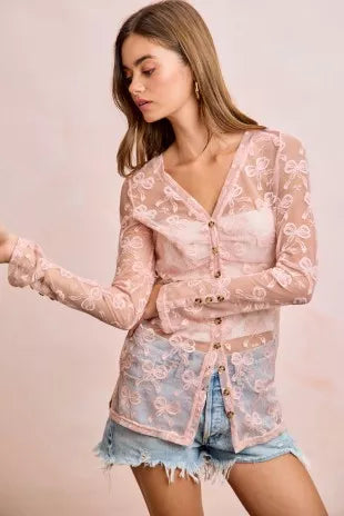 Dusty rose sheer mesh cardigan with V-neck and button front, long sleeves, bow-pattern print