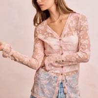 Dusty rose sheer mesh cardigan with V-neck and button front, long sleeves, bow-pattern print