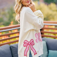 Cream sweatshirt with red bow patch and red/blue stars-and-stripes print