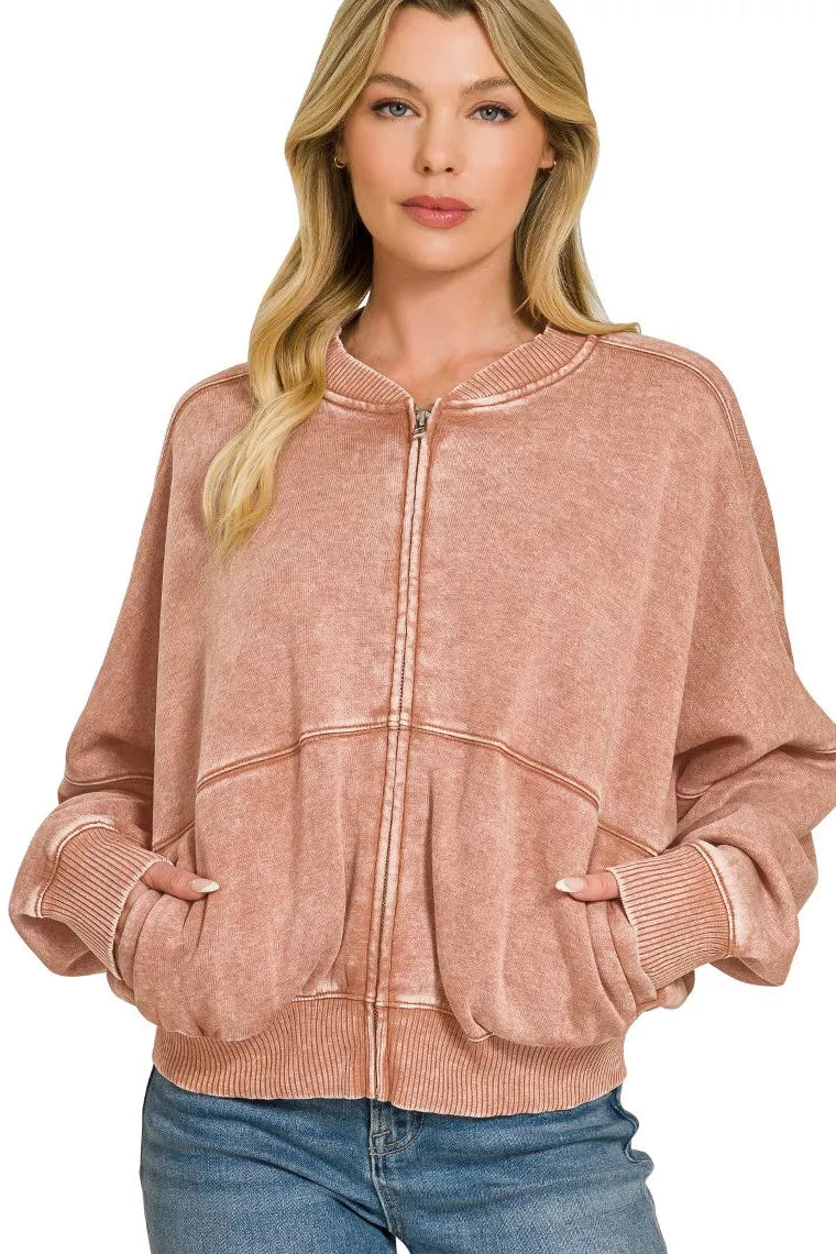 Rust acid-washed fleece zip jacket with ribbed stand collar, cuffs, and hem