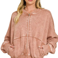 Rust acid-washed fleece zip jacket with ribbed stand collar, cuffs, and hem
