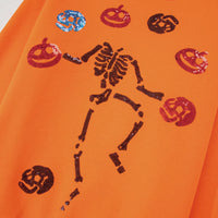 Orange crewneck sweatshirt with multicolor sequin Halloween critter and skeleton graphic