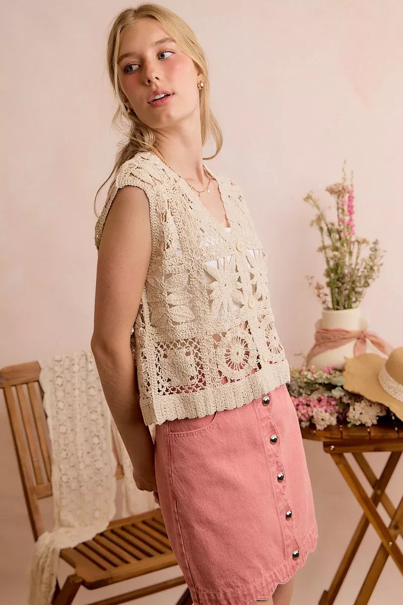Natural crochet sleeveless vest top with V-neck and button front, patchwork lace details