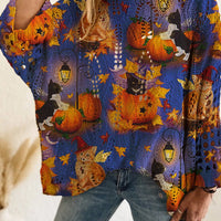 Plus size loose knit cover-up with blue and purple pumpkin print and festive Halloween motifs.