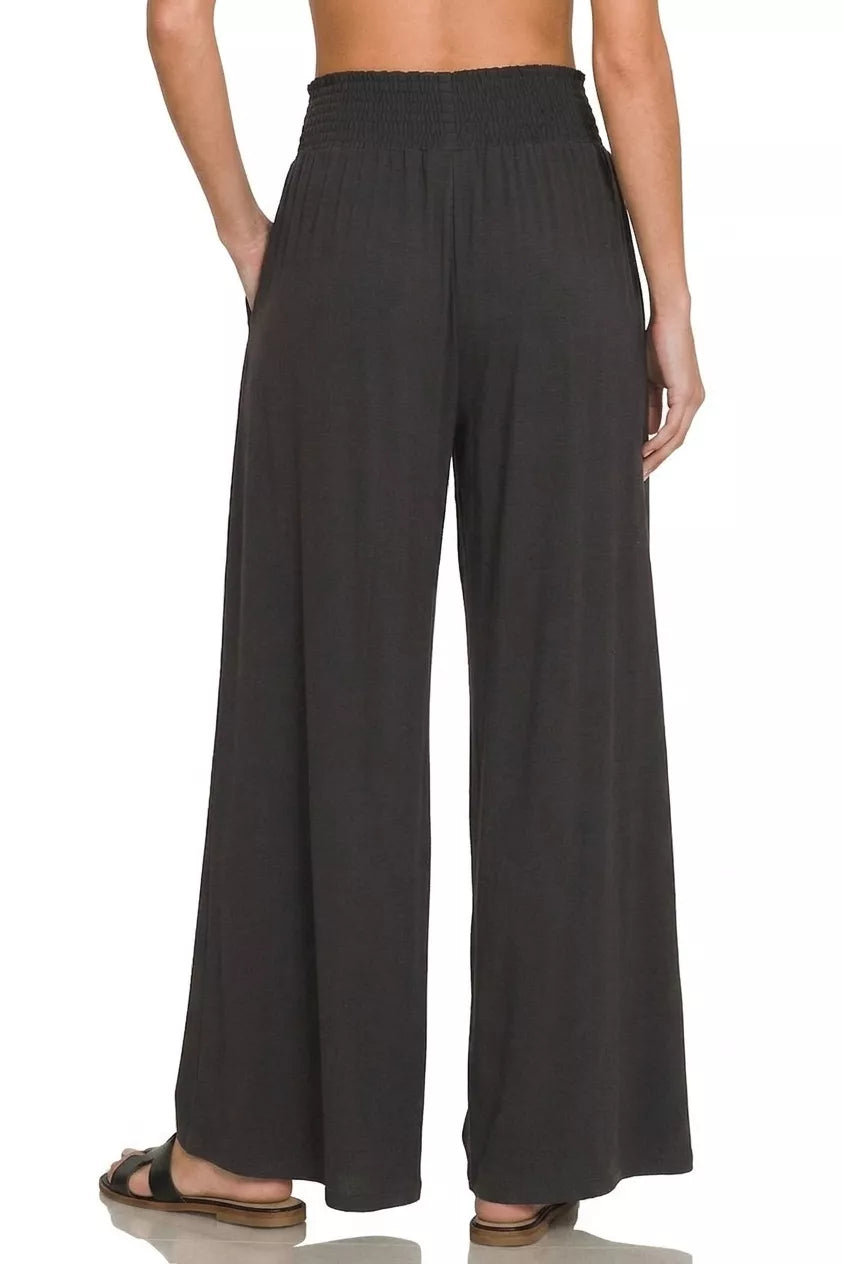 Black smocked-waist wide-leg palazzo pants with straight wide legs