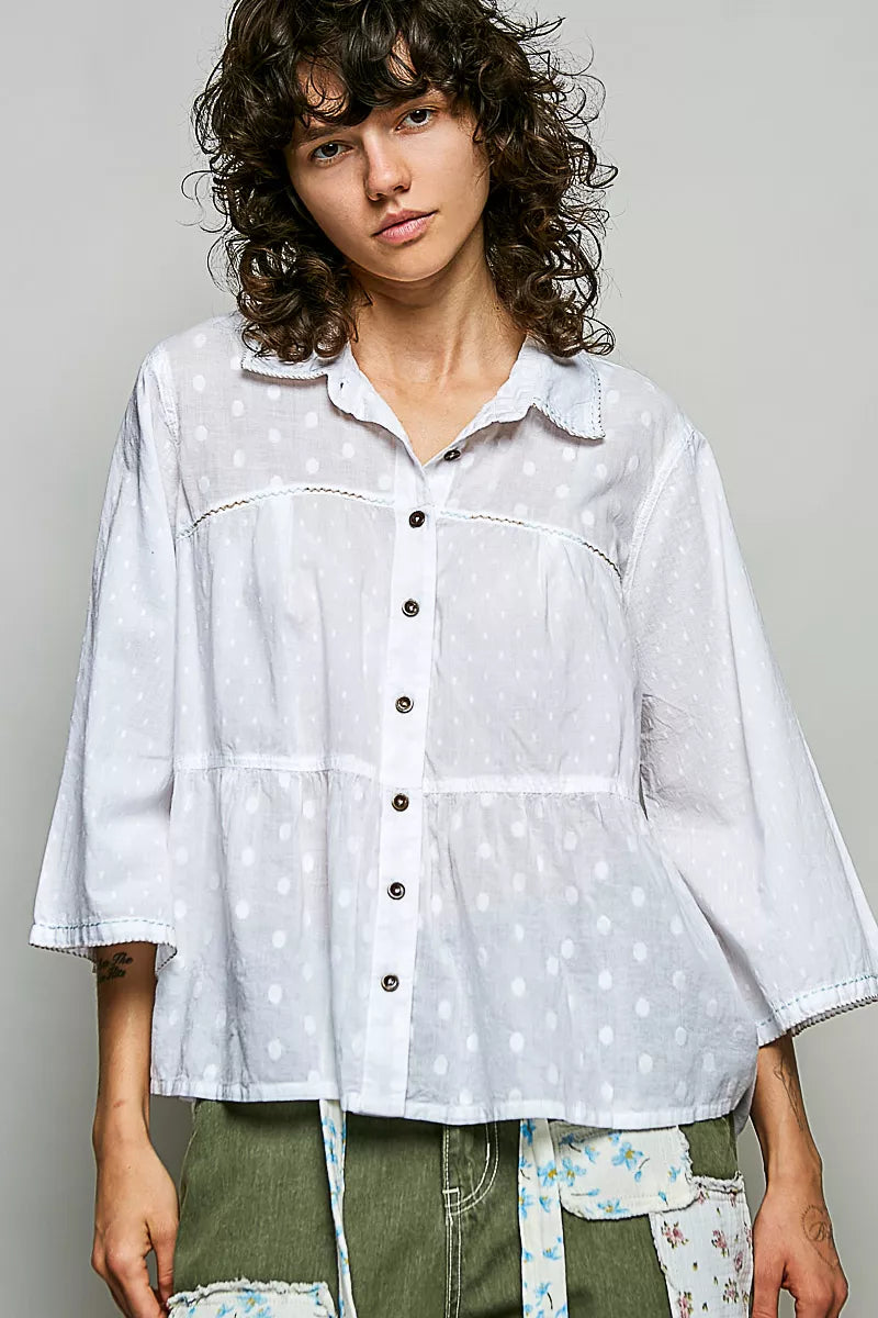Off-white button-front shirt with tonal dot texture and relaxed collar