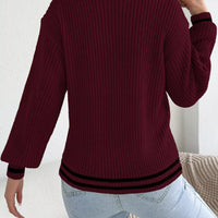 Burgundy cable knit sweater, back view with ribbed cuffs and hem