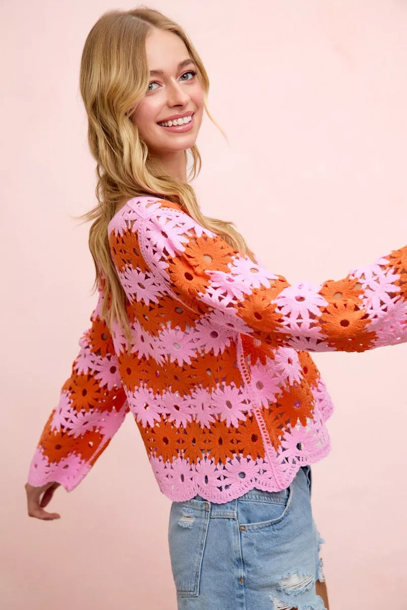 Orange and pink floral crochet top, long sleeves with scalloped crochet trim.