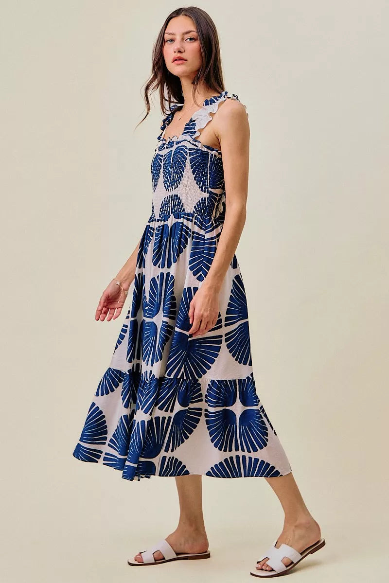 Navy abstract print tiered midi dress with smocked bodice and tiered skirt tiers