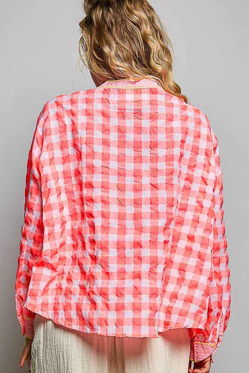 Pink gingham embroidered blouse, back view with gathered shoulders and seams