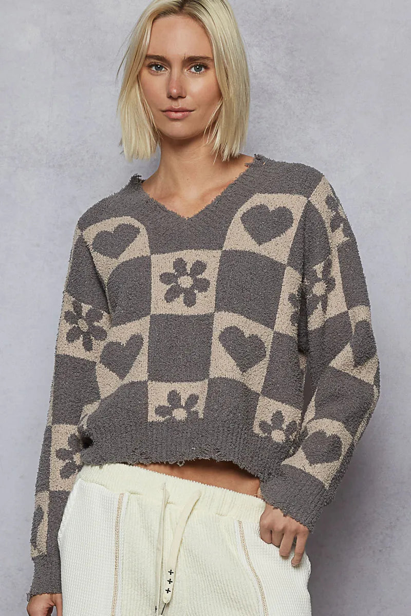 Women’s V-neck heart checkered sweater in gray with beige heart and flower squares.