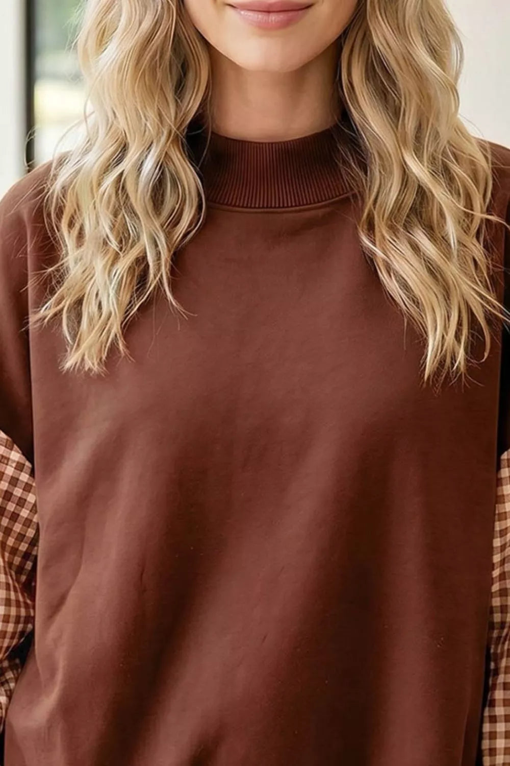 Dark brown loose tunic sweatshirt with ribbed crew neck and plaid check sleeve