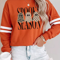 Orange Halloween pullover with ghost graphic and white stripe sleeve detail