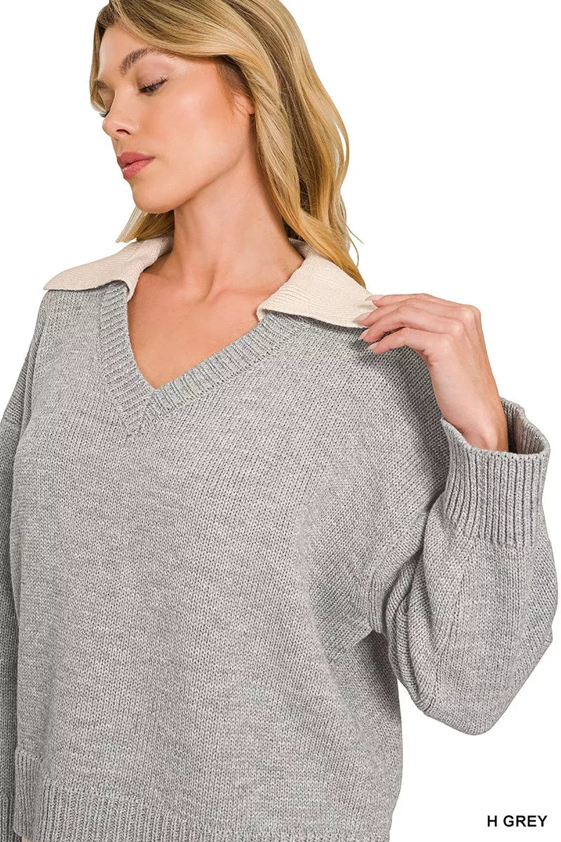 Grey V-neck sweater with beige collared trim and ribbed cuffs, long sleeves