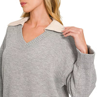 Grey V-neck sweater with beige collared trim and ribbed cuffs, long sleeves