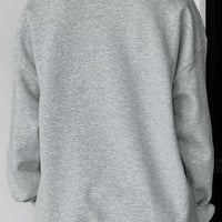 Gray oversized pullover sweatshirt back view with relaxed fit and ribbed cuffs