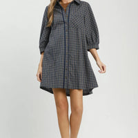 Navy plaid oversized shirt dress with collared neckline and three-quarter sleeves