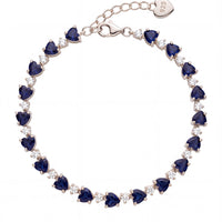 Silver tennis bracelet with navy blue heart-cut gemstones and connector clasp