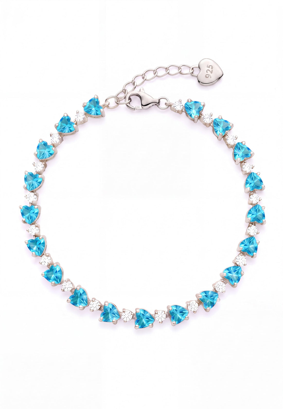 Silver tennis bracelet with heart-cut blue topaz stones and oval clasp tag