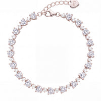 Heart tennis bracelet with oval stones and heart clasp charm