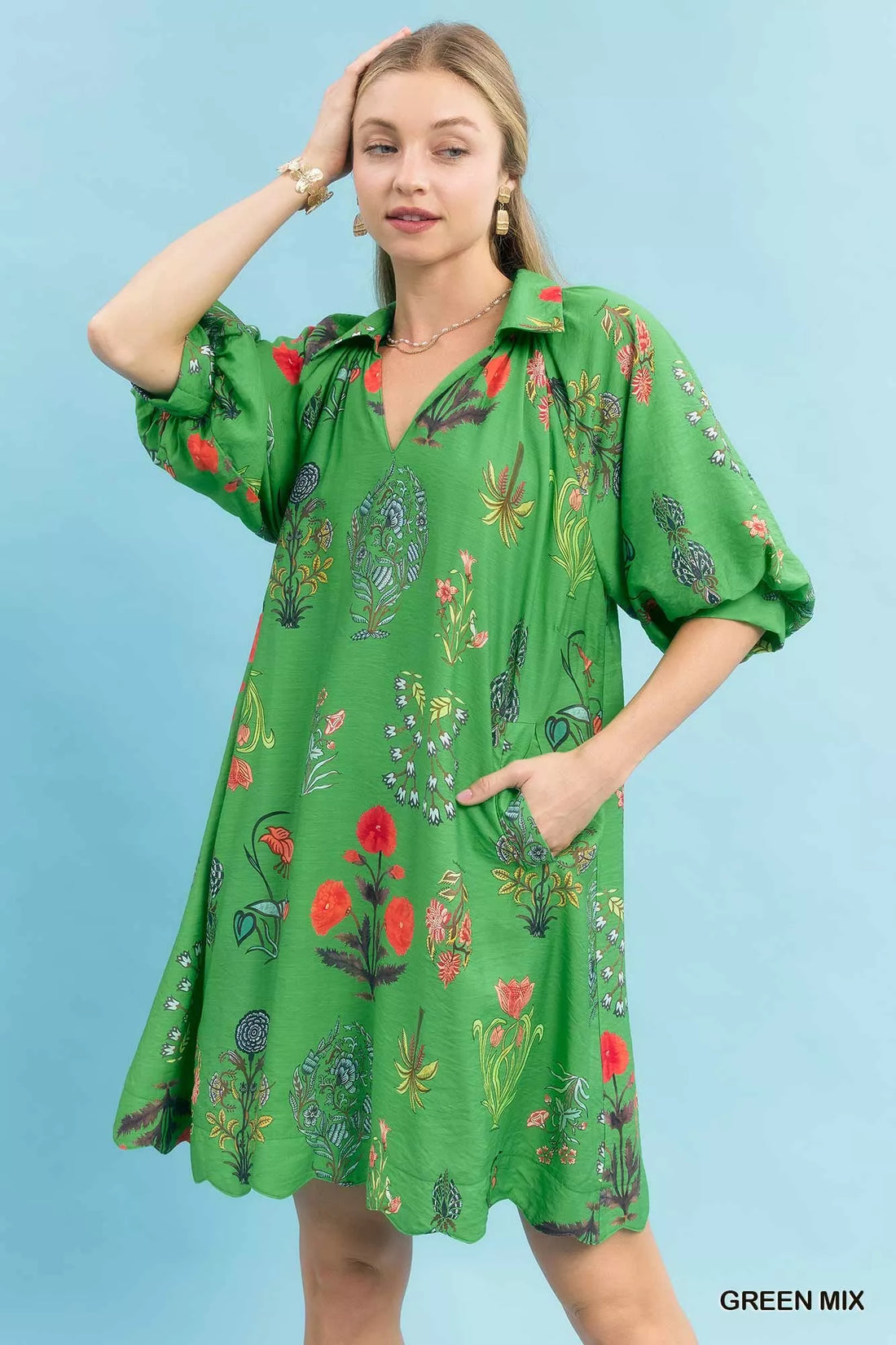 Green floral mini dress with V-neck and short puff sleeves, loose flowy fit
