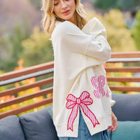 Cream sweatshirt with red bow patch and stars-and-stripes graphic