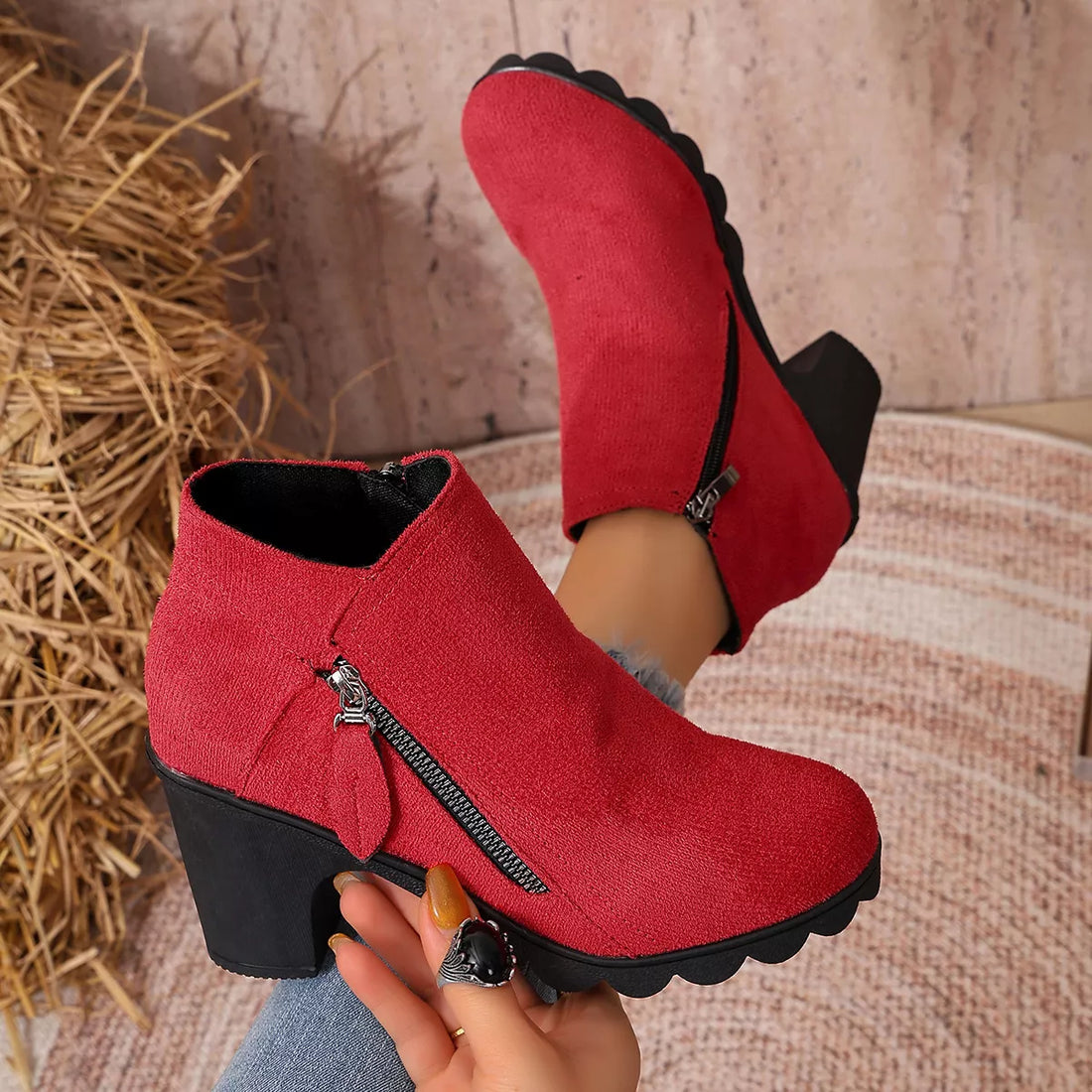 Red suede ankle boots with block heel, round toe, and side zipper detail