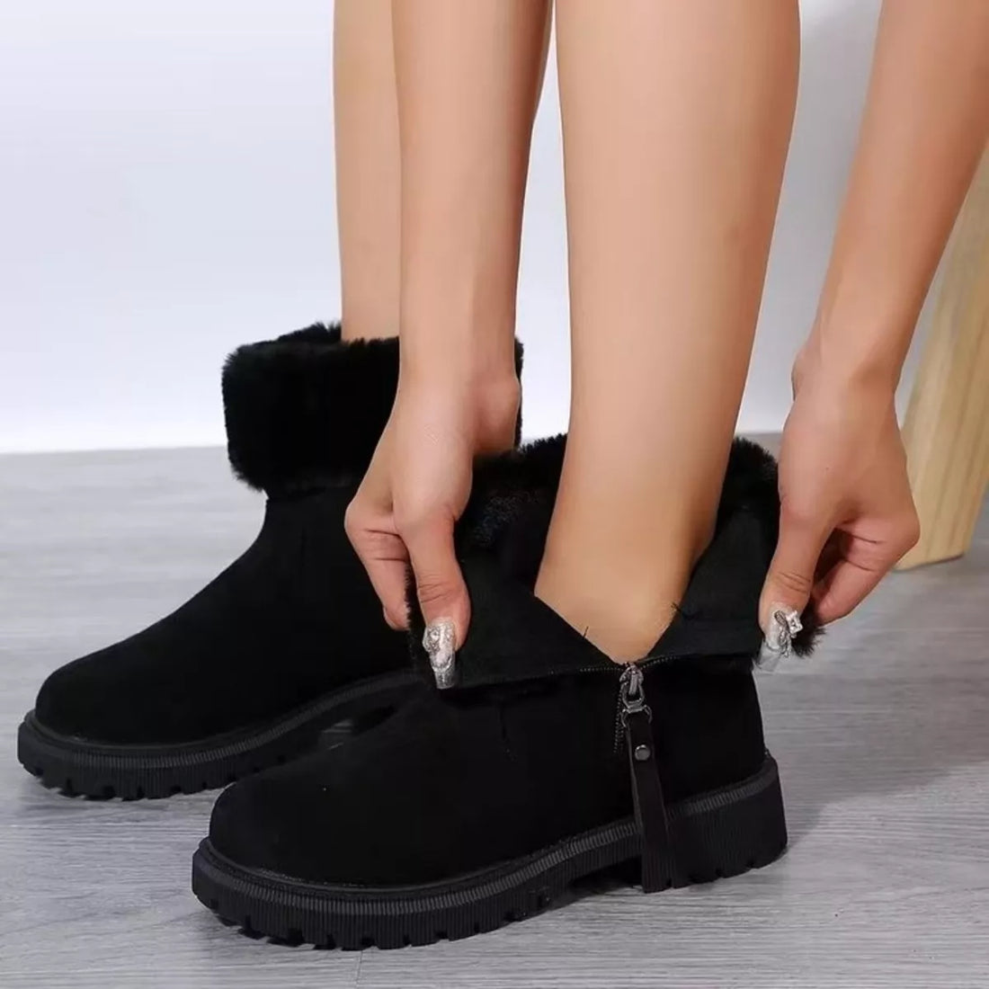 Black faux fur lined side-zip platform ankle boots with chunky tread lug sole