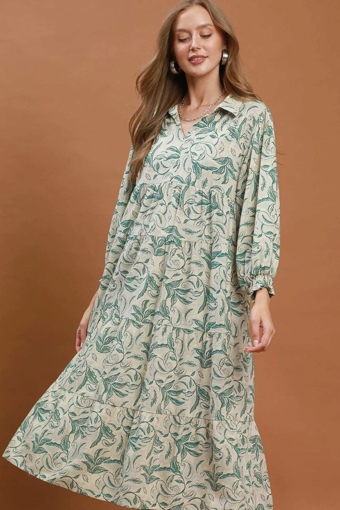 Green linen botanical print tiered midi dress with long sleeves and V-neck