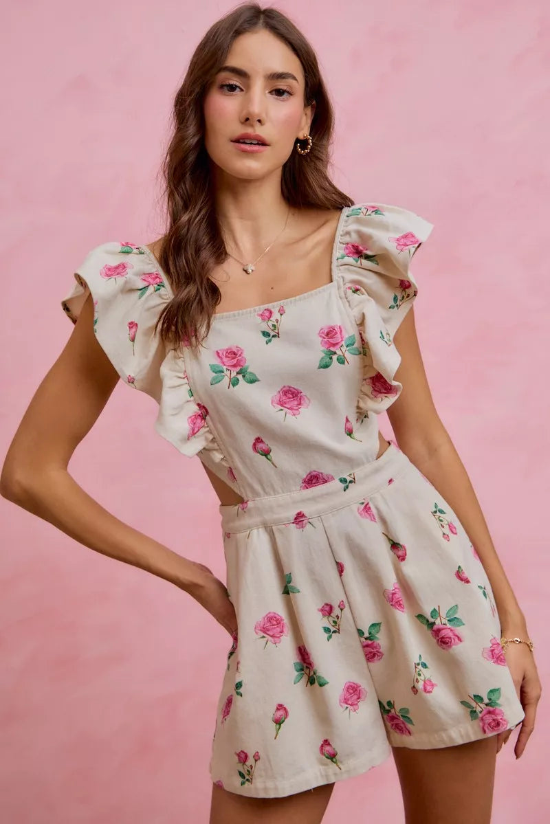 Ivory floral romper with square neckline, ruffled cap sleeves and cinched cut-out waist