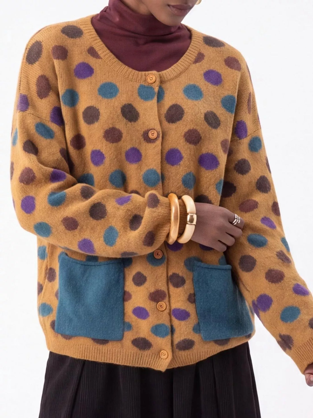Plus-size mustard polka-dot button cardigan with two blue front patch pockets, long sleeves