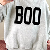 Light gray reversible mock-neck sweatshirt with large black “BOO” front graphic