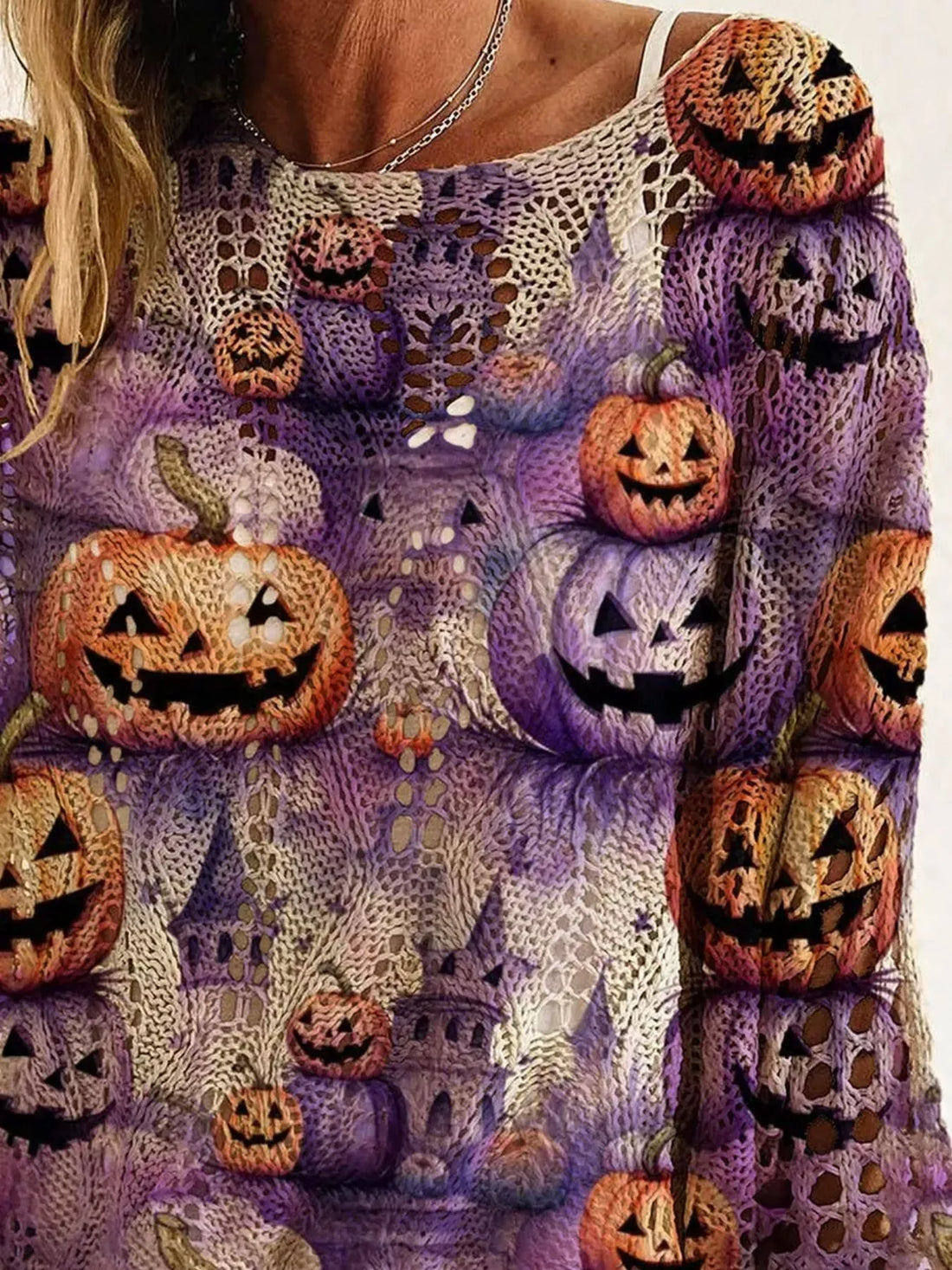 Plus size loose knit cover-up close-up with purple fabric and orange jack-o&