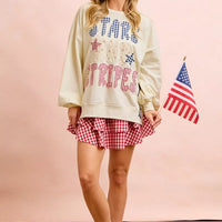 Cream sweatshirt with stars-and-stripes graphic, patch-style print, long sleeves