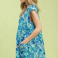 Blue tropical floral swing dress with flutter sleeves and fitted waist seam