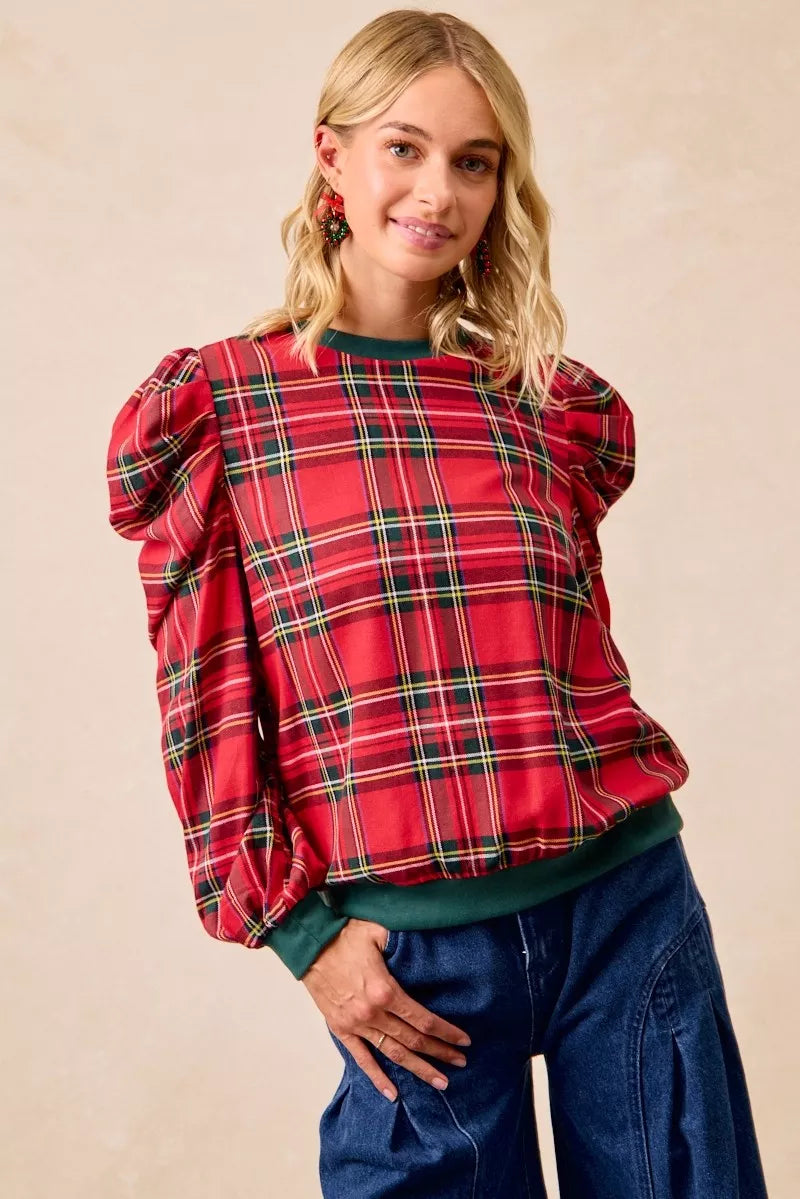 Red plaid blouse with puff sleeves, exaggerated shoulders, and green ribbed crew neckline