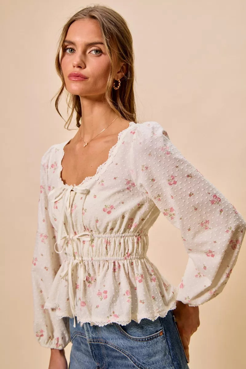 White floral clip-dot lace-trim ruched bodice blouse with long puff sleeves and peplum hem