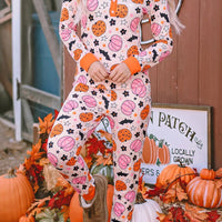 Dusty pink pumpkin-print long-sleeve lounge set with orange-trim buttons and cuffed pants