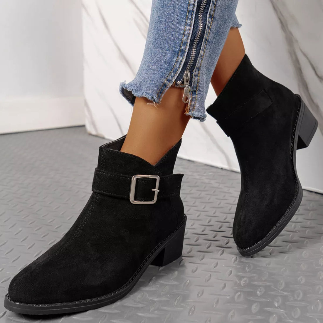 Black suede point-toe block heel ankle boots with square buckle strap detail