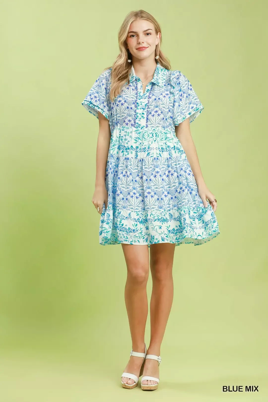 Blue floral tiered mini dress with flutter sleeves, front full view