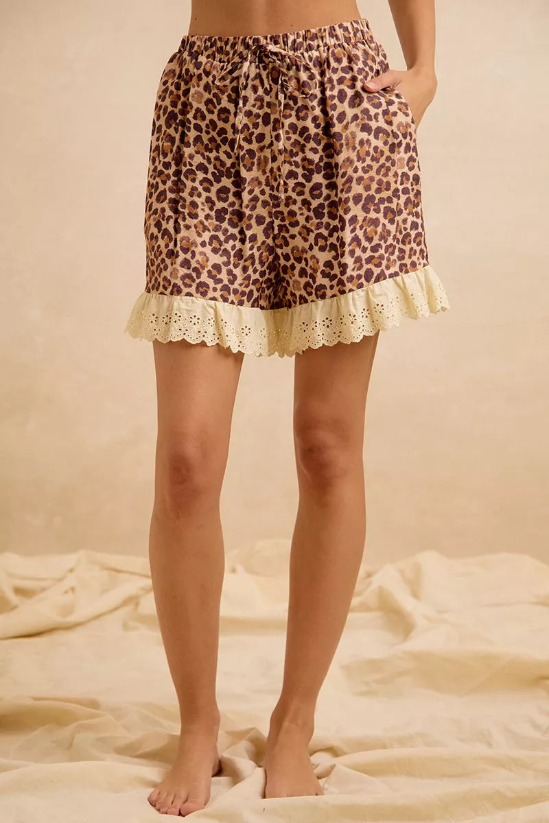 Leopard print shorts with drawstring waist and eyelet lace ruffle hem