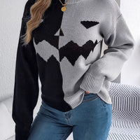 Two-tone pumpkin face graphic sweater, light gray/black zip-front knit, long sleeves