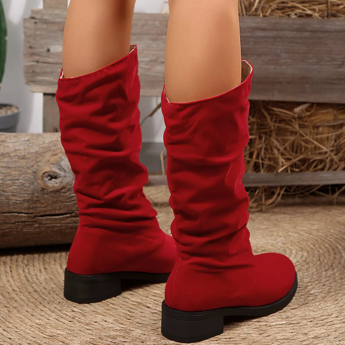 Red round-toe block heel boots with ruched knee-high shaft, rear view