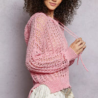 Pink openwork knit top with long sleeves and crew neck in textured knit